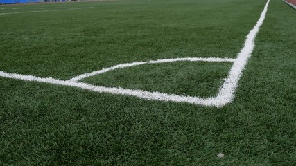 Obraz premium football Soccer field corner with green sport artificial grass