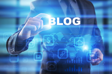 Businessman selecting blog on virtual screen.