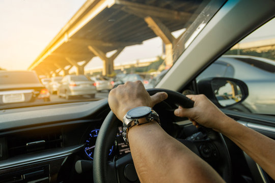 Closeup Left Hand Driving On Traffic Jam Background, Business Co