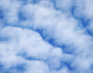 White clouds on blue background