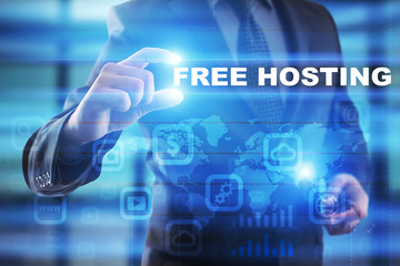 Businessman selecting free hosting on virtual screen.