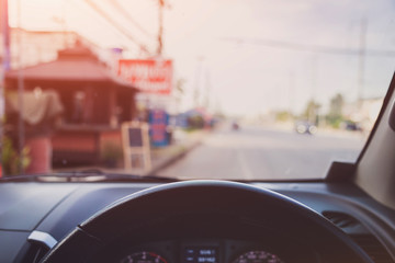 Fototapeta premium Vintage tone picture of View from the driver angle on city road