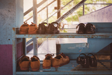 Sneakers old student in a rural school. vintage tone