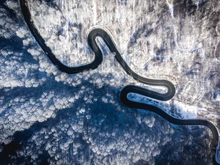  Winding road in the middle of the winter © Calin Stan