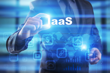 Businessman selecting iaas on virtual screen.