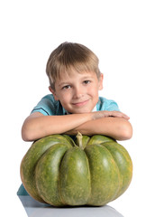 Fototapeta premium Cute boy sitting with pumpkin