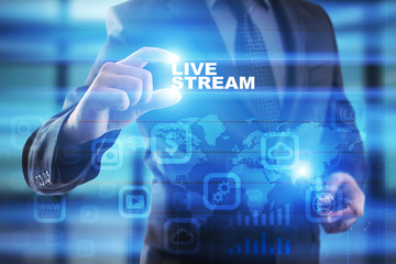 Businessman selecting live stream on virtual screen.