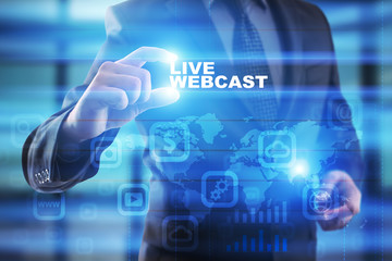 Businessman selecting live webcast on virtual screen.