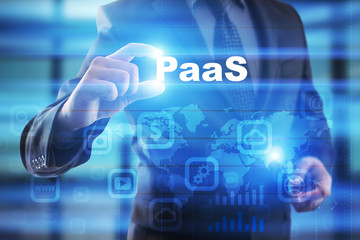 Businessman selecting paas on virtual screen.