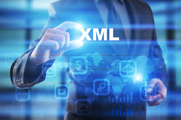 Businessman selecting xml on virtual screen.