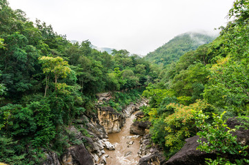 Fototapeta na wymiar Rocky mountain river gorge at Ob Luang national park in Thailand
