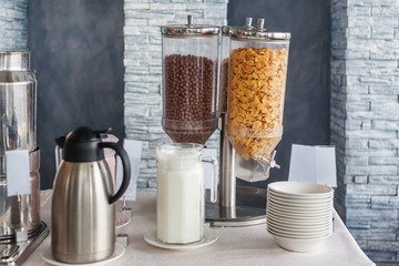 Dispenser Breakfast buffet with chocolate balls and corn flakes