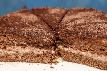 Slices of chocolate cake with cream closeup