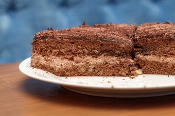Slices of chocolate cake with cream closeup