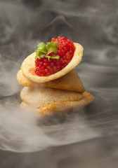Red caviar on chicken chips
