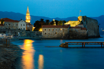 Old Town of Budva, Montenegro. Night cityscape. Ancient walls at twilight, medieval walled city,...