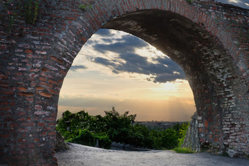 view from the arch of the old castle at sunset