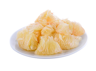 Grapefruit in white plate isolated on white background