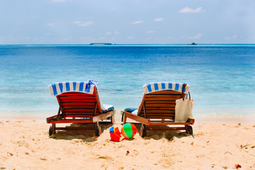Two chairs on the tropical beach