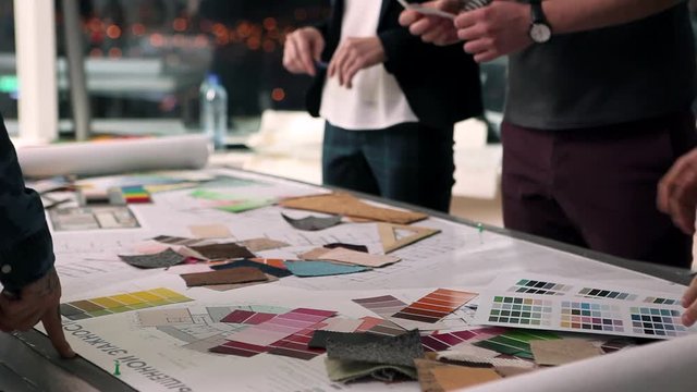 Designers at Work/A group of young designers led by the head are working on the project of design business center, private home, studio, shop, office