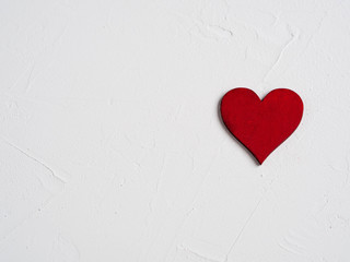 One red heart on a white background.Card on Valentine's Day

