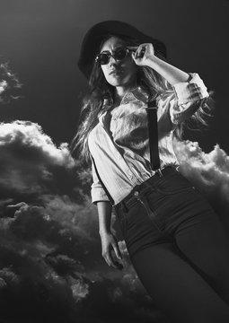 Woman wearing sunglasses in the sky