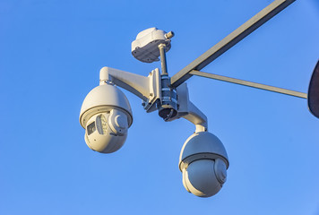 Security cctv cameras on pylon in blue background