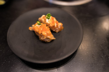 Various sushi on black dish background.Tasty sushi.
Traditional fresh japanese sushi rolls on a black dish. Tasty sushi. Japanese Food