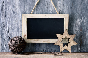 christmas ball and star, and blank chalkboard