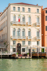 Fototapeta na wymiar colorful traitional Venice house palazzio over water of canal, Italy