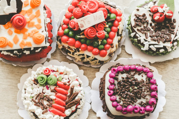 Close up small cakes on wood for background/texture. Vintage or retro tone.