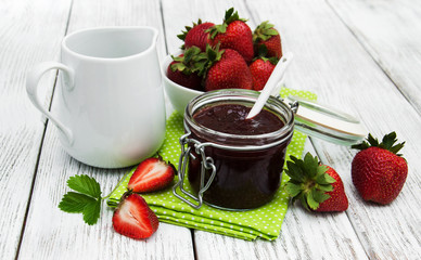 Strawberry jam and fresh strawberries
