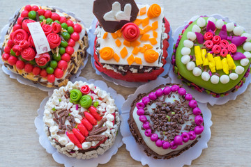 Close up small cakes on wood for background/texture.