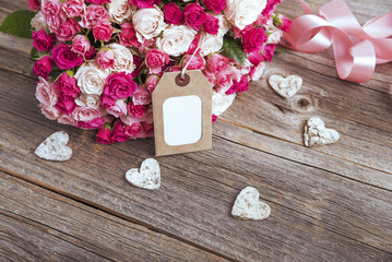 Bouquet of roses and card.