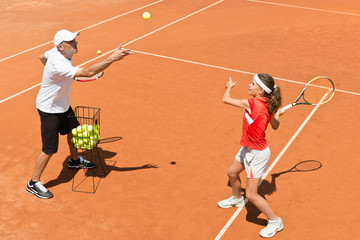 Junior tennis player in training