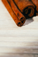 several fragrant cinnamon sticks on a white background