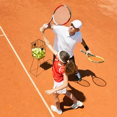 Foto op Canvas Tennis coach and junior female tennis player © Microgen
