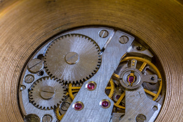Macro cog clockwork mechanism close up micro workings of watch with metallic wheels timepiece precise motion & rotation