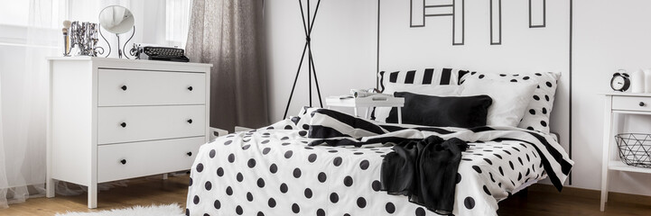 Light bedroom with patterned bedding