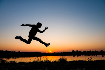 silhouette man jumping