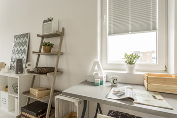 Grey desk and wooden shelf in the living room