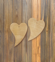 Two wooden hearts on a wooden background. Top view. Valentines days. Love symbol. Greeting card.Vintage style. Greeting card.