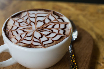 latte on wooden table brown color