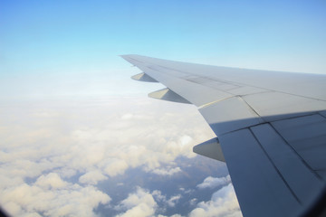 Obraz premium view of the aircraft wing on the sky
