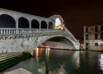 Naklejka na ściany i meble Venice Grand Canal near the Rialto bridge at night - Venice, Italy