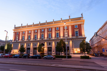 Fototapeta na wymiar City street view at sunset, historic building with angels near karlsplatz, in vienna, austria