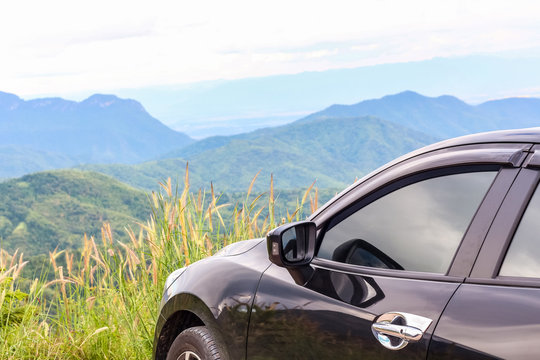 Closeup car over the mountain background, travel concept with copy space