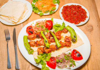 Tasty grilled marinated beef shish kebabs with colorful bell pepper and tomato
