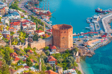 Landscape with marina and Kizil Kule tower in Alanya peninsula, Antalya district, Turkey - obrazy, fototapety, plakaty