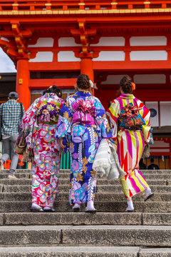 Women in traditional japanese kimonos on the street of Kyoto, Japan.